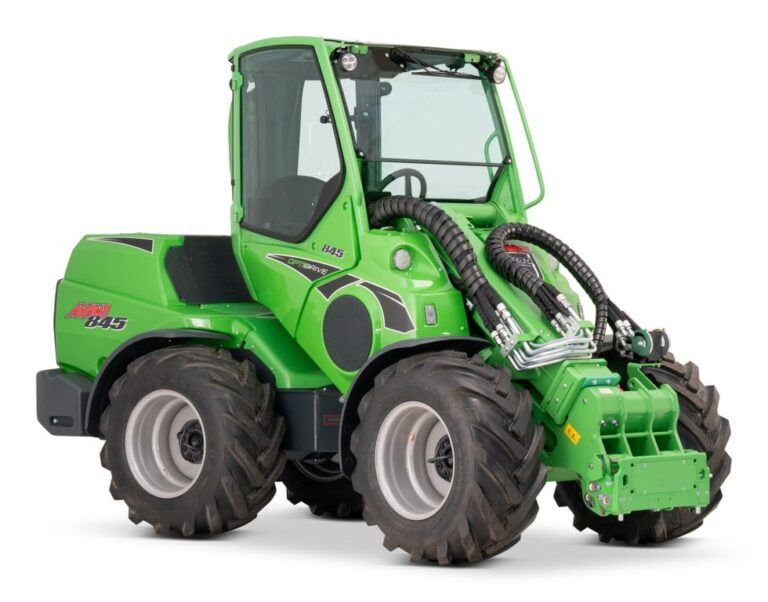 Avant 845 GT mini loader with an enclosed cabin and large rugged tires, showing the front hydraulic attachment area. The green loader is designed for heavy-duty tasks in various industries, offering versatility and powerful performance.