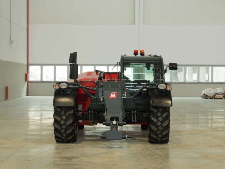 Front view of the Magni TH 5.8P telescopic handler in an indoor facility.